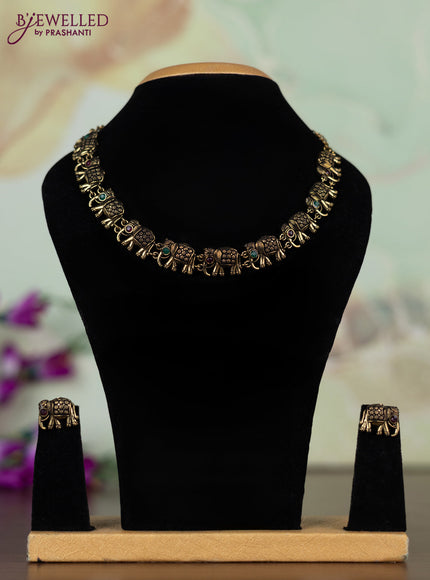Oxidised necklace with elephant design with kemp stones in gold finish