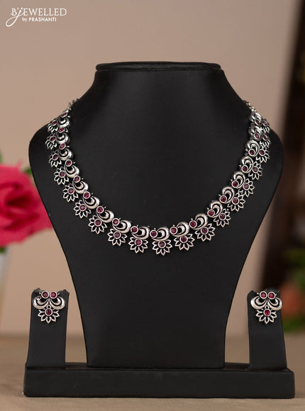 Oxidised necklace with floral design in red stones