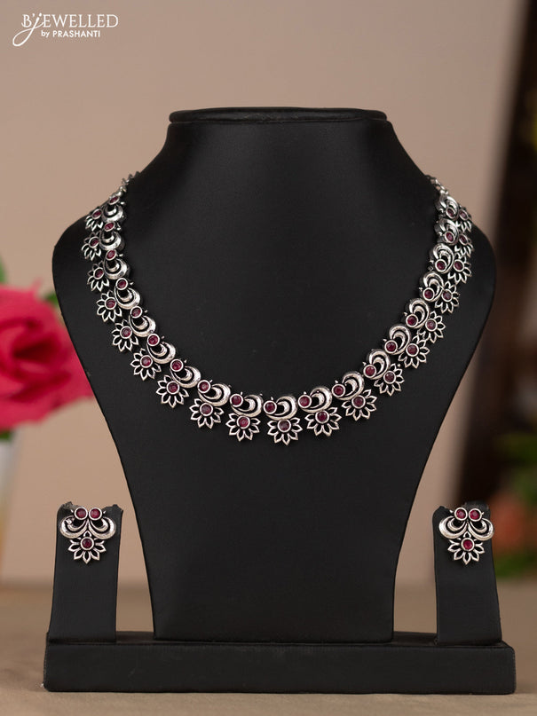 Oxidised necklace with floral design in red stones