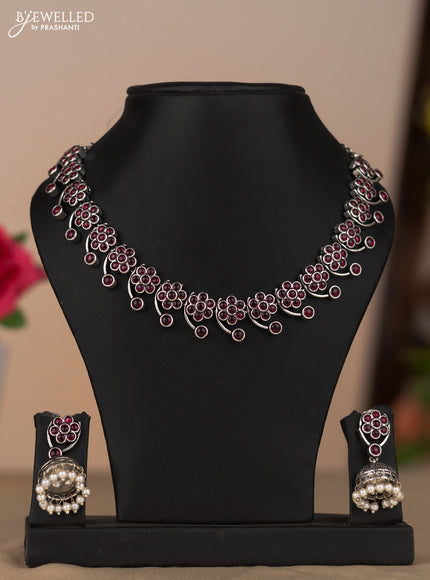Oxidised necklace with floral design in red stones