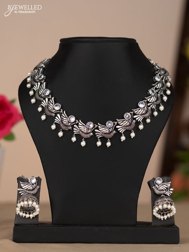 Oxidised necklace bird design in white color stones