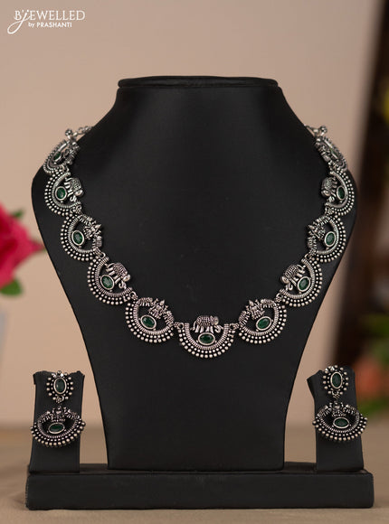 Oxidised necklace with elephant and lakshmi deisgn in green stones