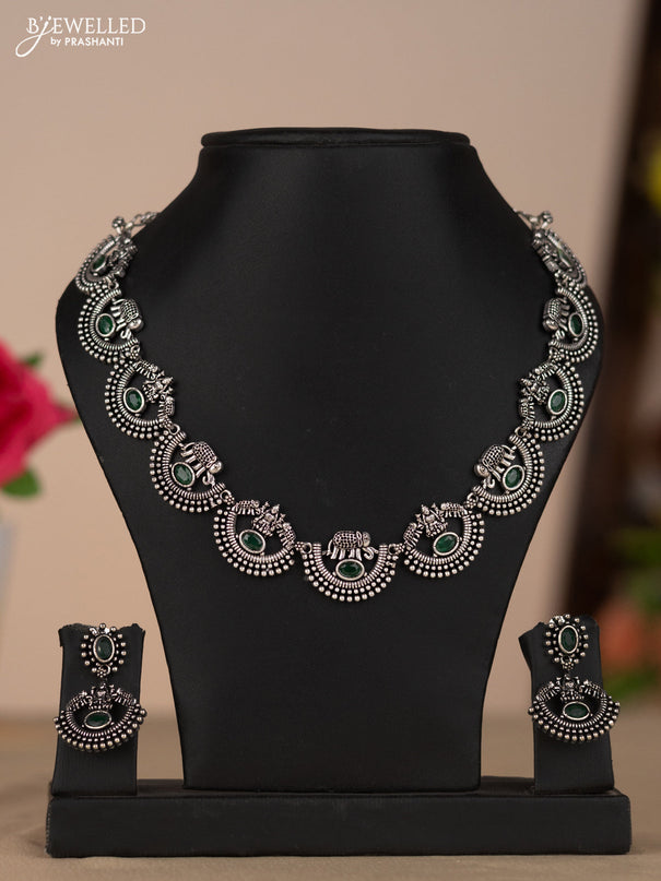 Oxidised necklace with elephant and lakshmi deisgn in green stones