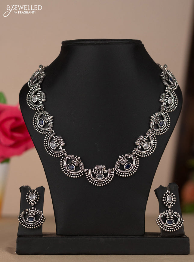 Oxidised necklace with elephant and lakshmi deisgn in blue & white stones