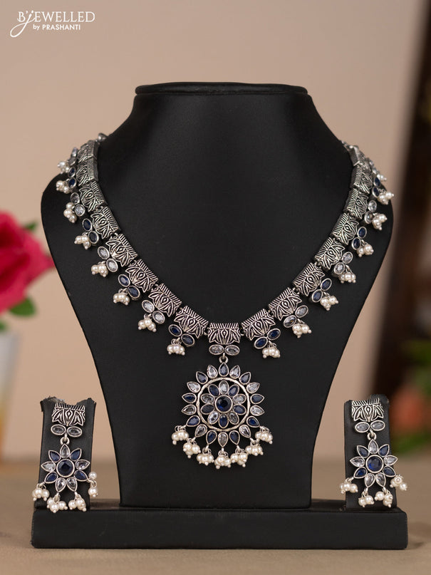 Oxidised necklace with floral design in blue & white stones