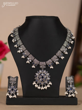Oxidised necklace with floral design in blue & white stones