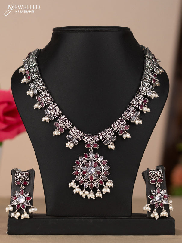 Oxidised necklace with floral design in red & white stones