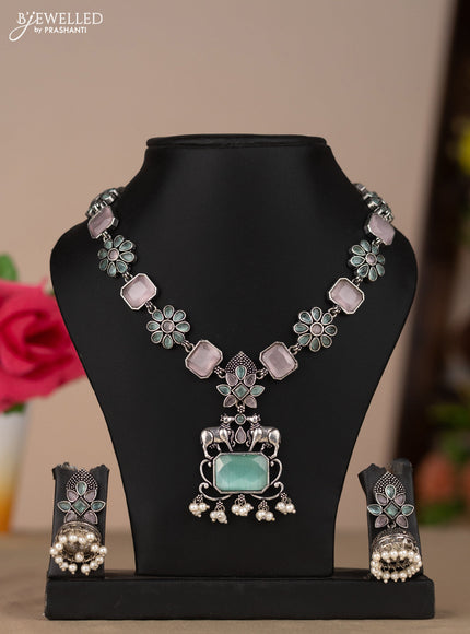 Oxidised necklace with floral design in pastel color stones