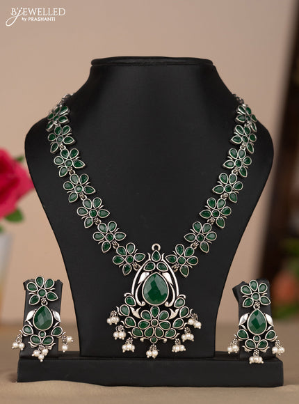 Oxidised necklace with floral design in green stones