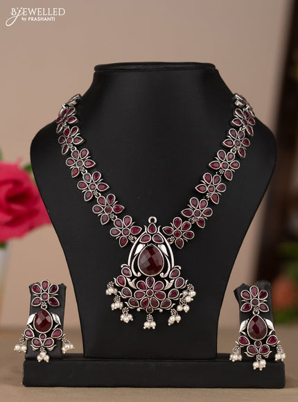 Oxidised necklace with floral design in red stones