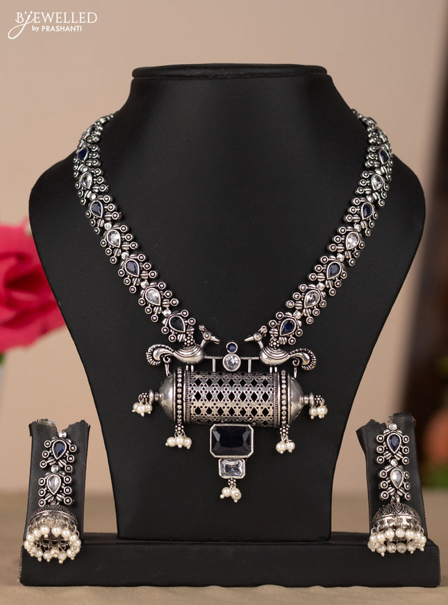 Oxidised necklace with peacock design in blue & white stones