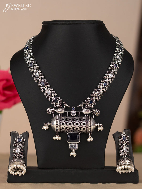 Oxidised necklace with peacock design in blue & white stones