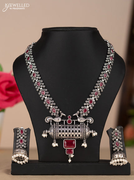 Oxidised necklace with peacock design in red stones