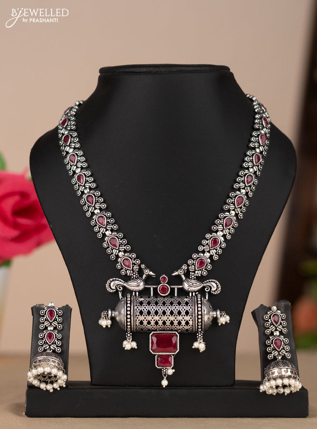 Oxidised necklace with peacock design in red stones