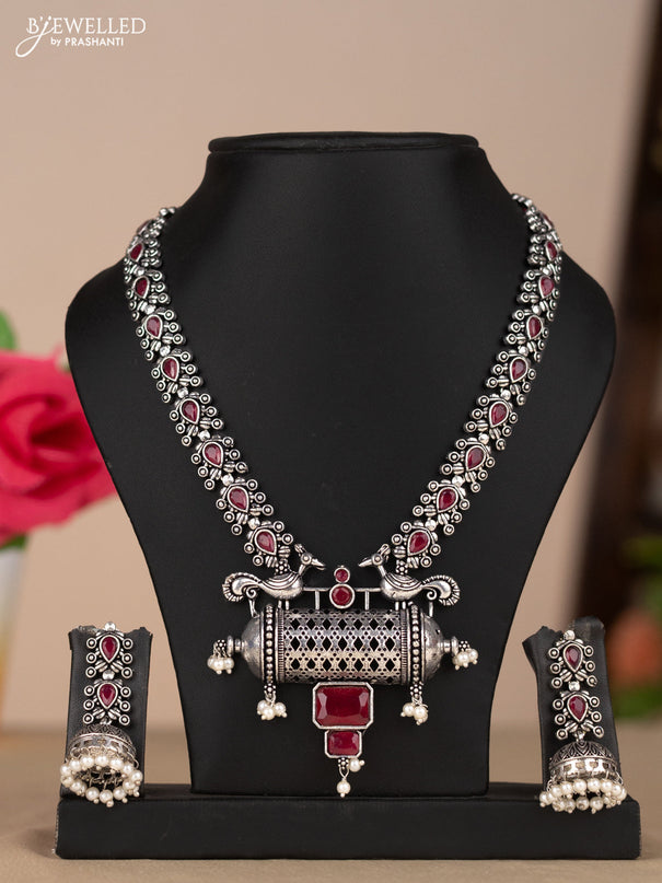 Oxidised necklace with peacock design in red stones