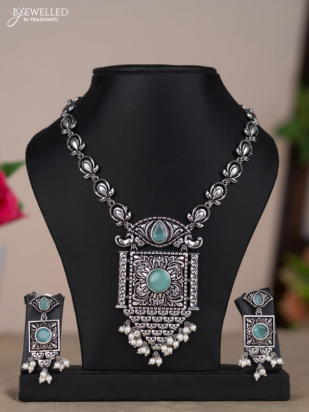 Oxidised necklace with floral design in pastel blue stones