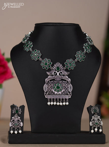 Oxidised necklace with floral design in green stones