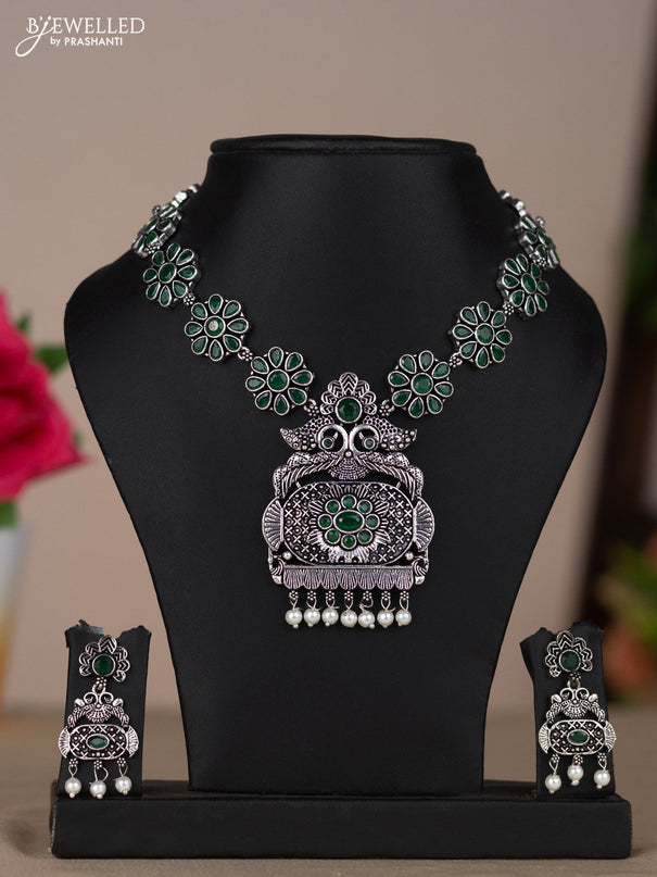 Oxidised necklace with floral design in green stones