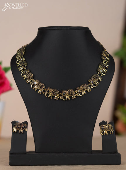 Oxidised necklace with elephant design and white & black stones in gold finish