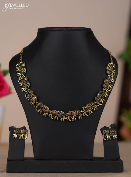 Oxidised necklace with elephant design and black stones in gold finish