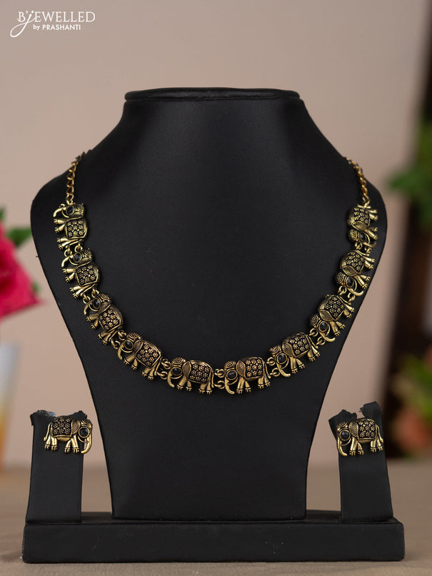 Oxidised necklace with elephant design and black stones in gold finish