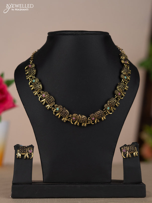 Oxidised necklace with elephant design and multicolor pastel stones in gold finish