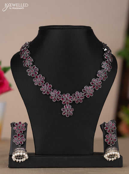 Oxidised necklace with floral design in red stones