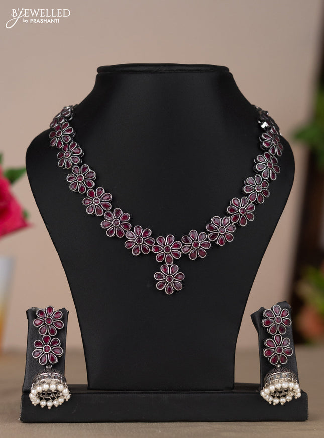 Oxidised necklace with floral design in red stones