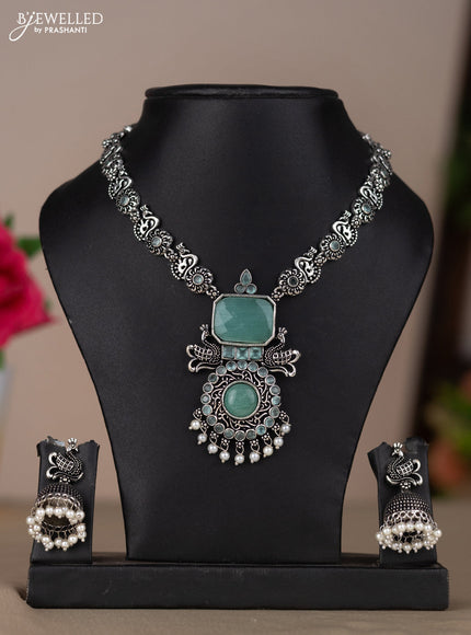 Oxidised necklace with peacock design in pastel blue stones