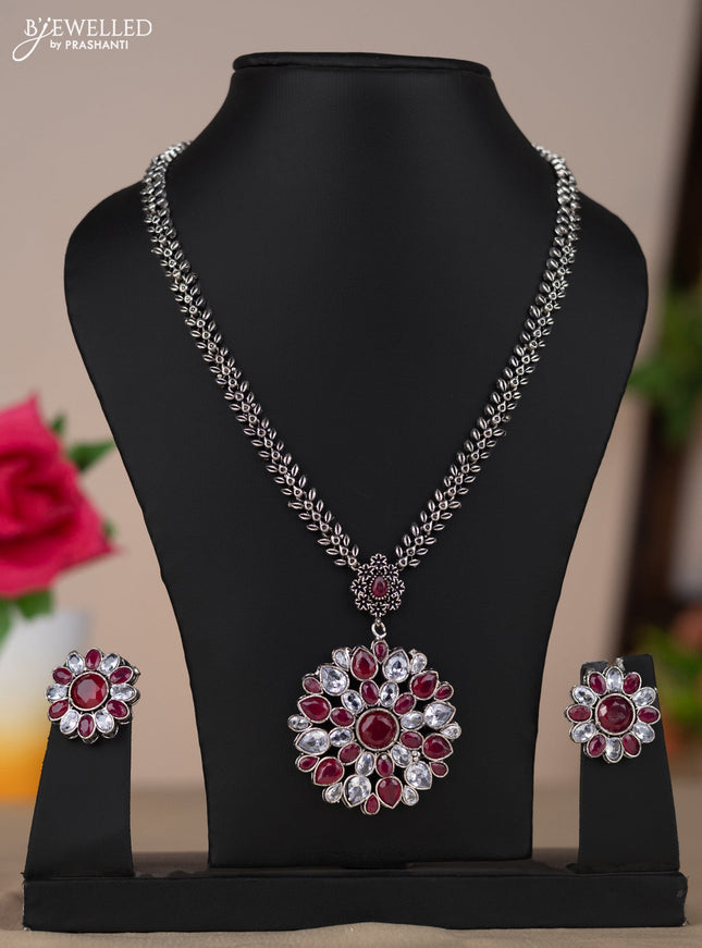 Oxidised necklace with floral design in multicolor red and white stones
