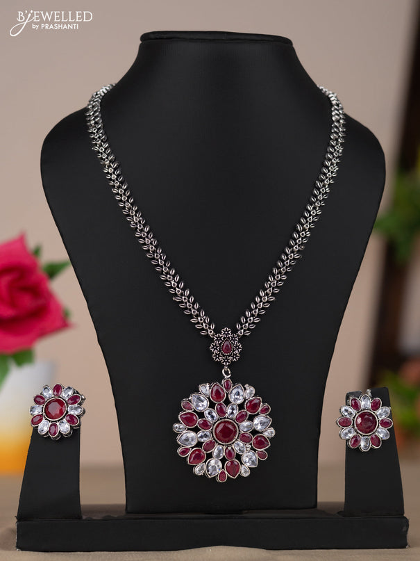 Oxidised necklace with floral design in multicolor red and white stones