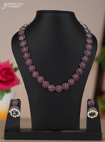 Oxidised necklace with floral design in red stones