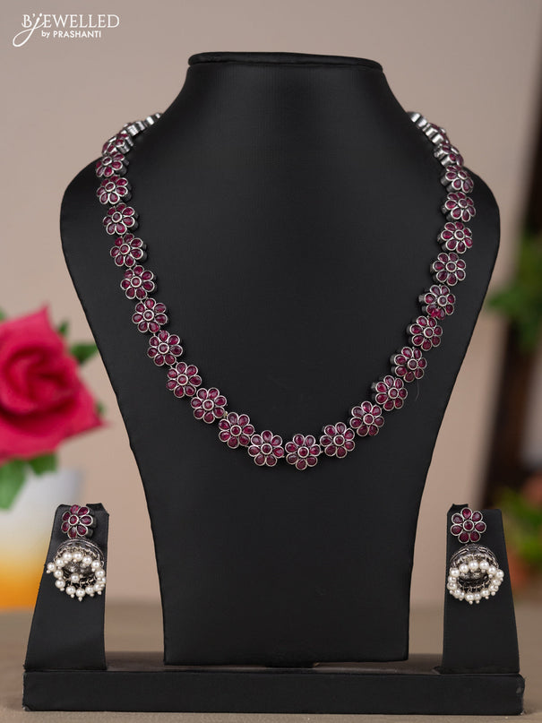 Oxidised necklace with floral design in red stones