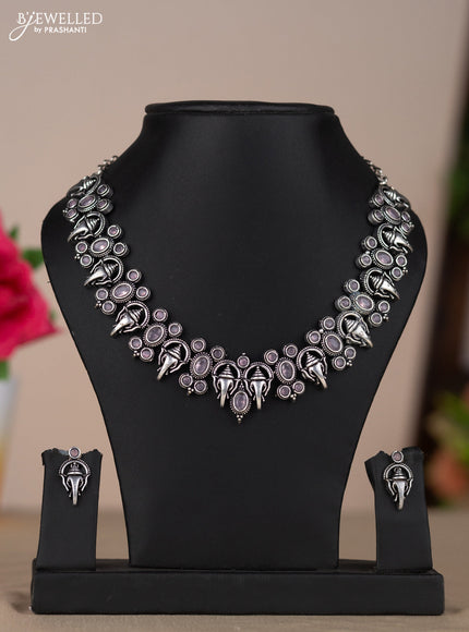 Oxidised necklace with ganesha design in pastel pink stones
