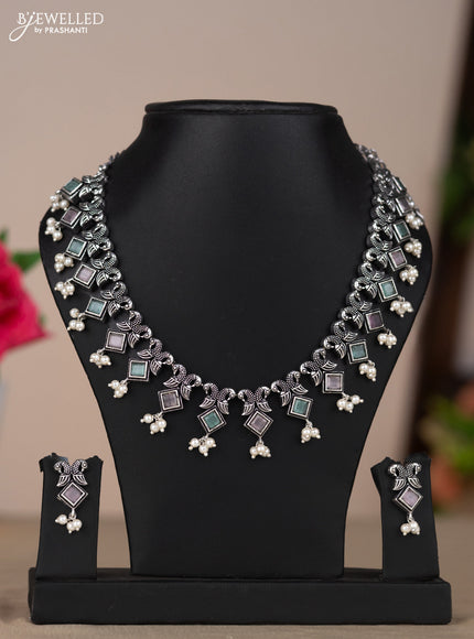 Oxidised necklace with double peacock design in multicolor pastel stones