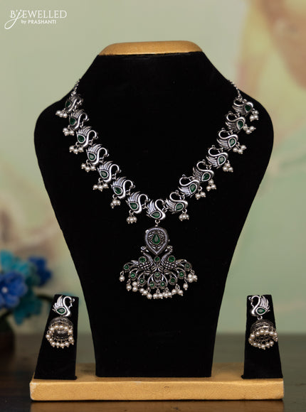 Oxidised necklace peacock design with emerald stones and pearl hangings