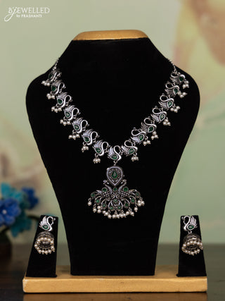 Oxidised necklace peacock design with emerald stones and pearl hangings