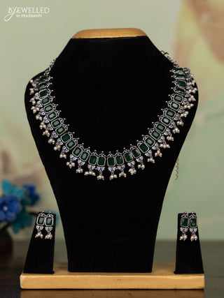 Oxidised necklace with emerald stones and pearl hangings