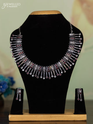 Oxidised necklace with ruby and white stones