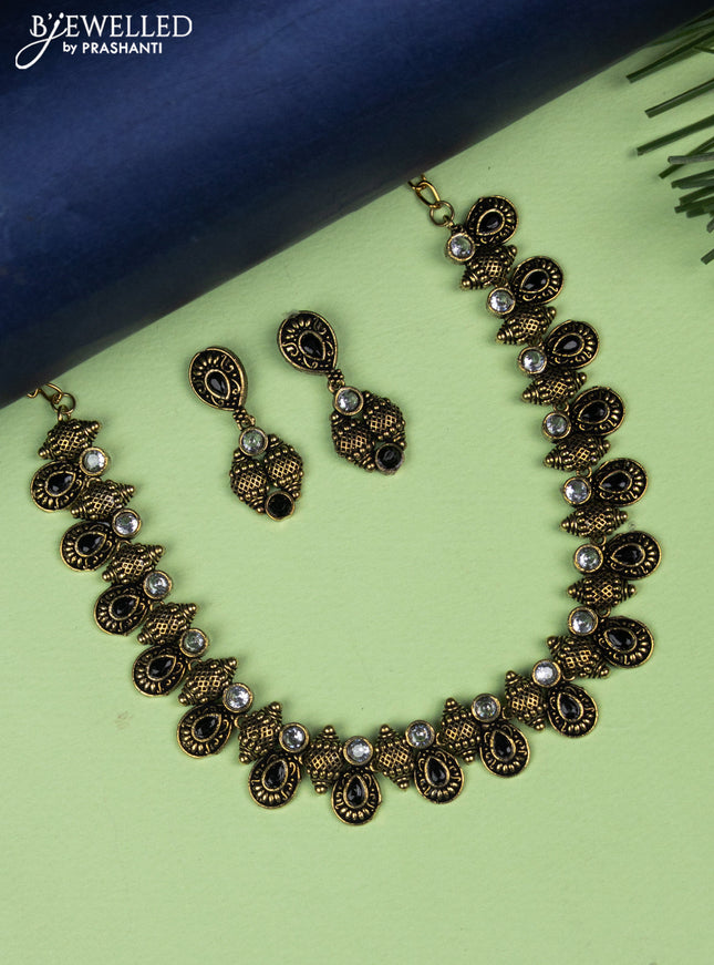 Oxidised necklace with black and white stones in gold finish