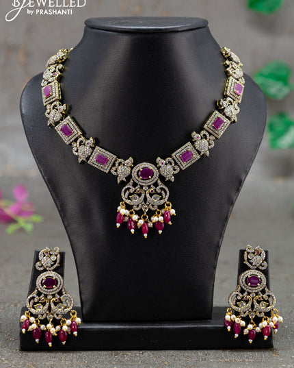 Necklace with pink kemp & cz stones and beads hanging in victorian finish