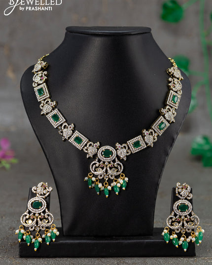 Necklace with emerald & cz stones and beads hanging in victorian finish