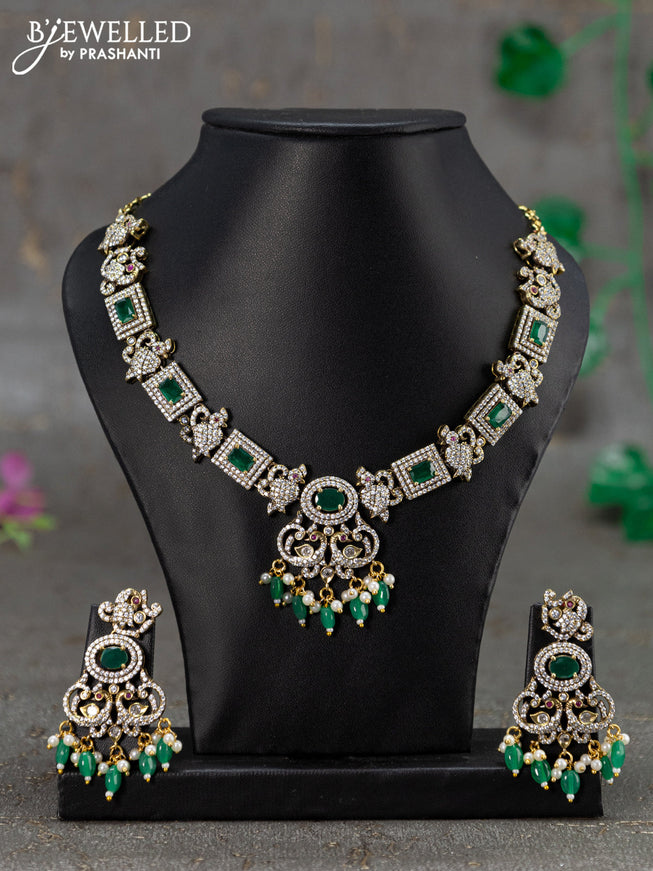 Necklace with emerald & cz stones and beads hanging in victorian finish