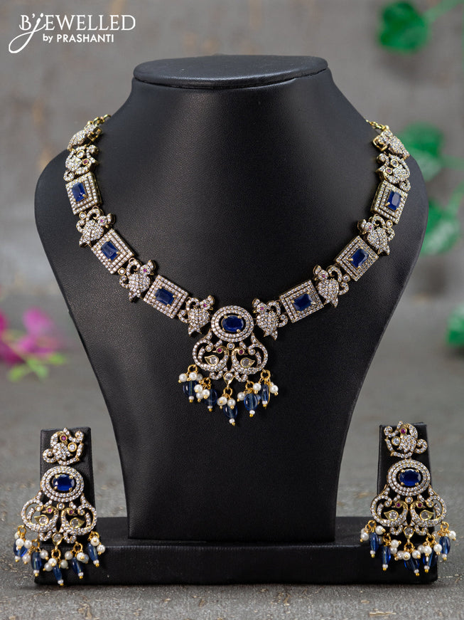 Necklace with sapphire & cz stones and beads hanging in victorian finish