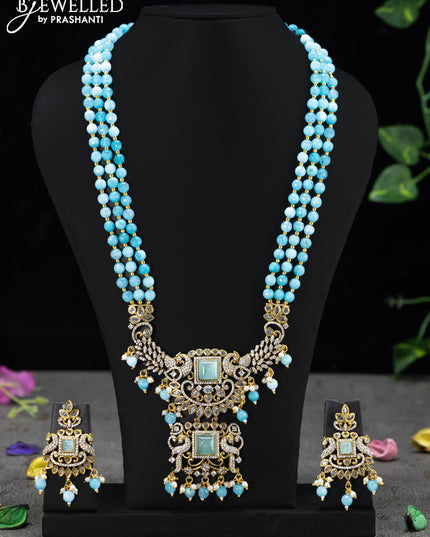 Beaded triple layer ice blue necklace with mint green & cz stones and beades hanging in victorian finish