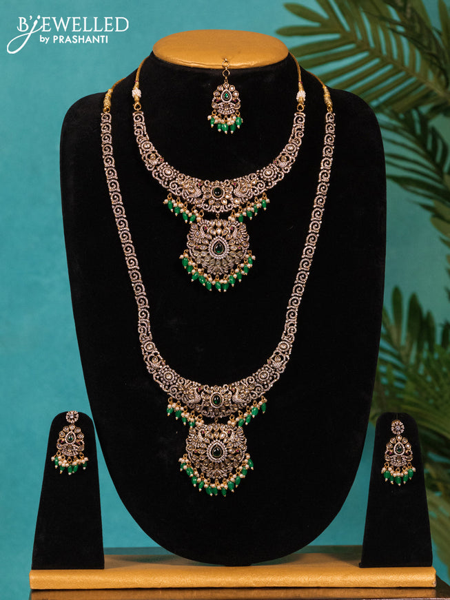 Victorian finish bridal set peacock design with emerald & cz stones and hangings