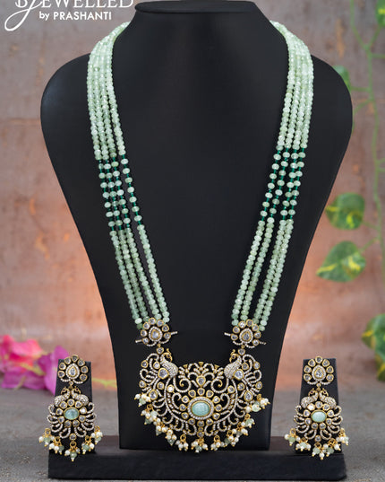 Beaded multi layer mint green necklace peacock design with cz stones and beads hanging in victorian finish