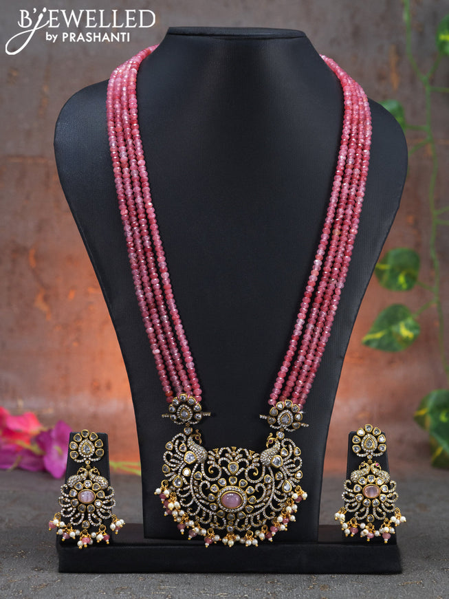 Beaded multi layer pink necklace peacock design with cz stones and beads hanging in victorian finish