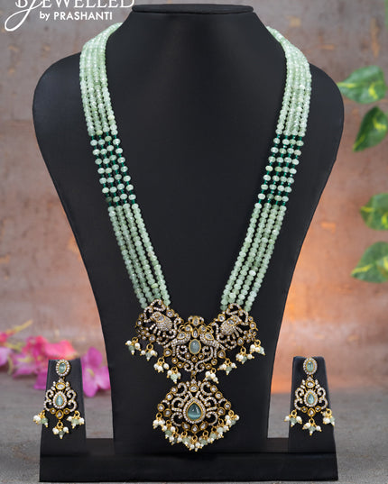Beaded multi layer mint green necklace elephant design with cz stones and beads hanging in victorian finish