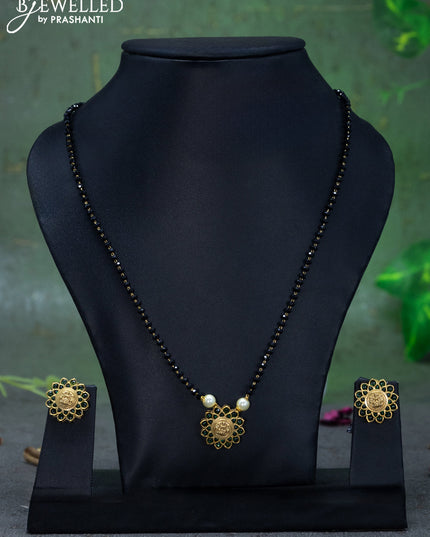 Mangalsutra with emerald stones and lakshmi pendant